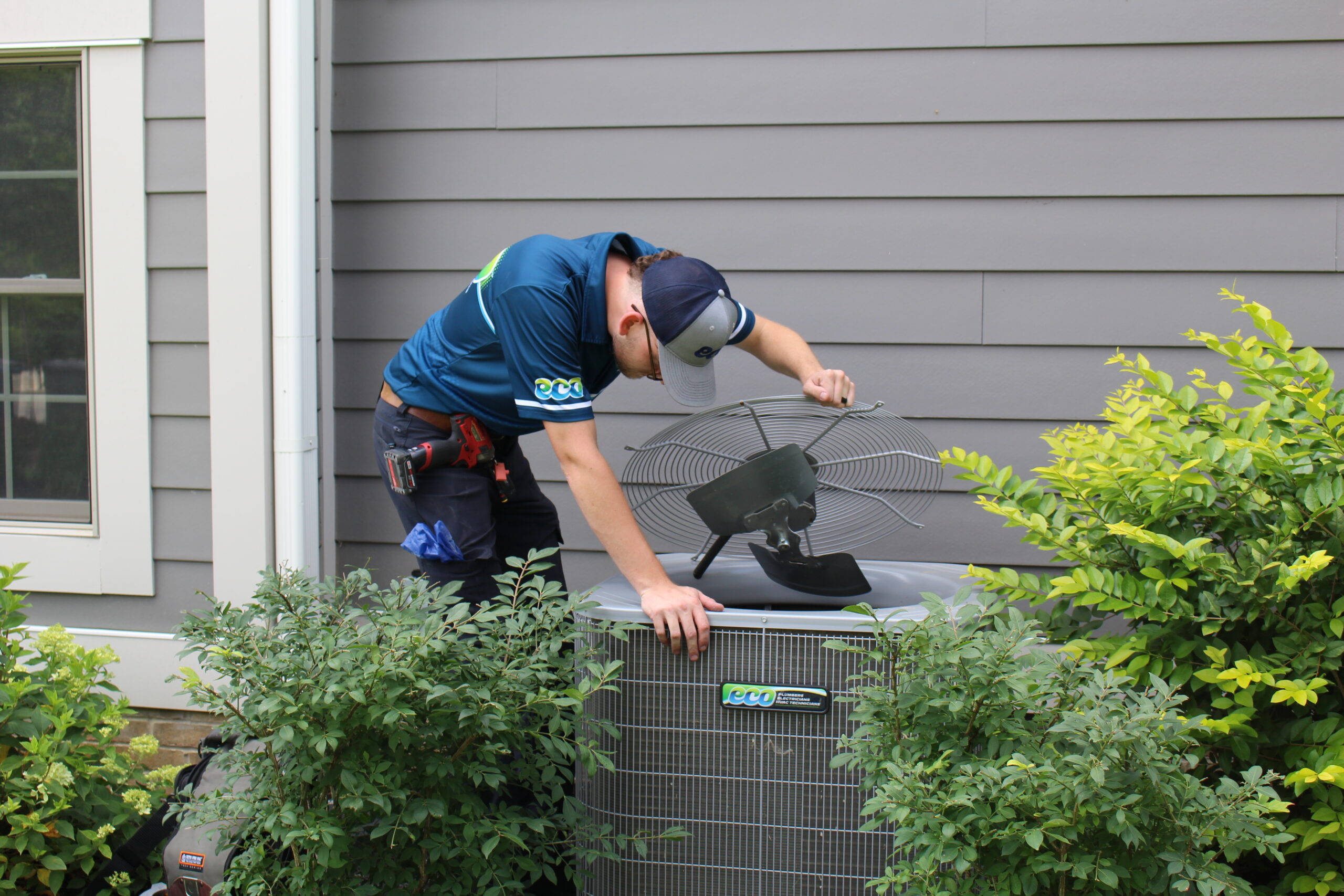 HVAC technician performing AC repair services in Gahanna at a residential property