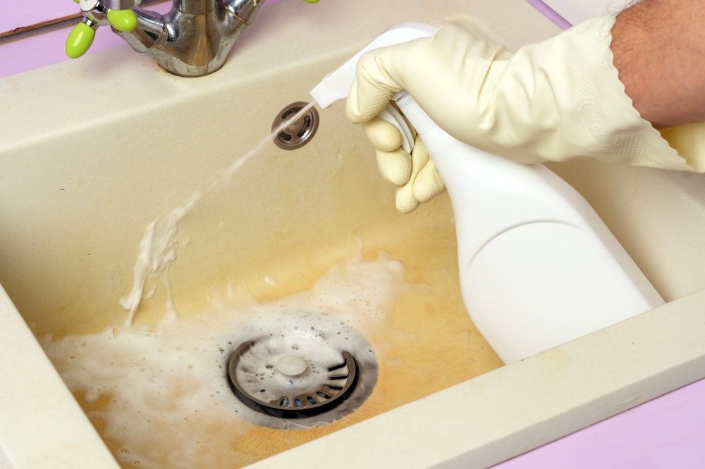Plumber inspecting repeatedly clogged drains in a Chillicothe, OH home