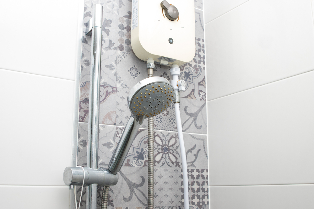Plumber installing a tankless water heater in a Chillicothe, OH home