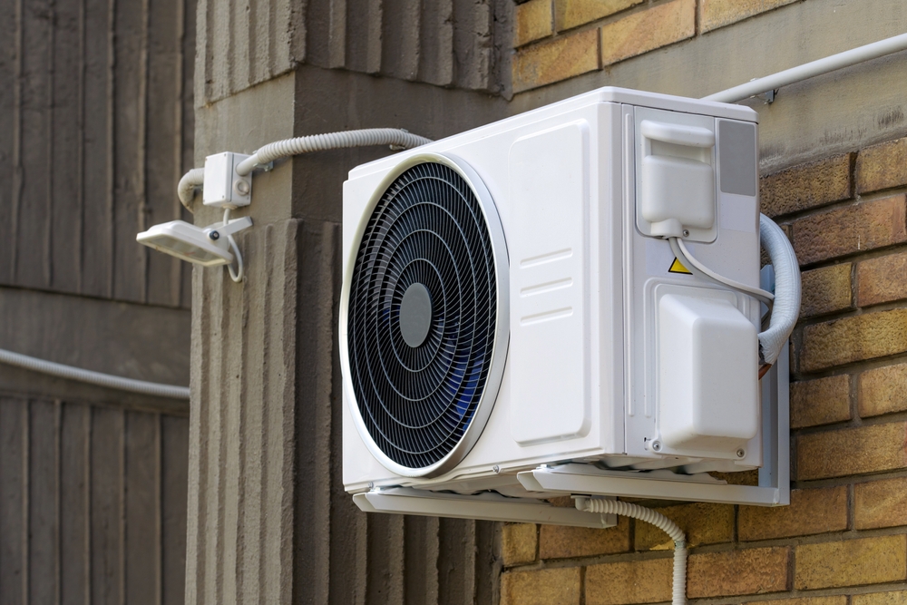 HVAC technician installing ductless mini split systems in a Cincinnati OH home