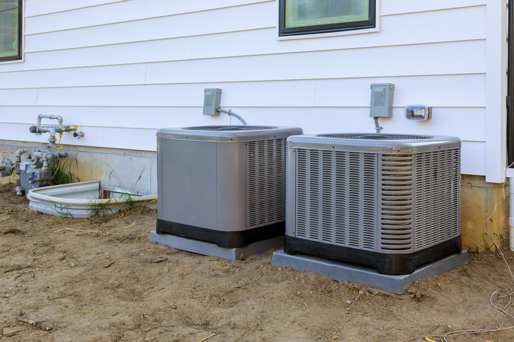 HVAC technician installing an energy-efficient heating and cooling system in an Ohio home
