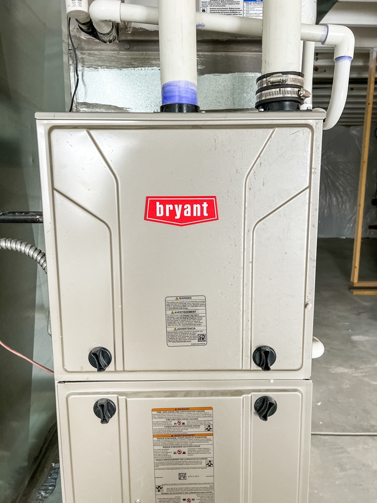 HVAC technician comparing gas vs electric furnace installation in a Cincinnati, OH home