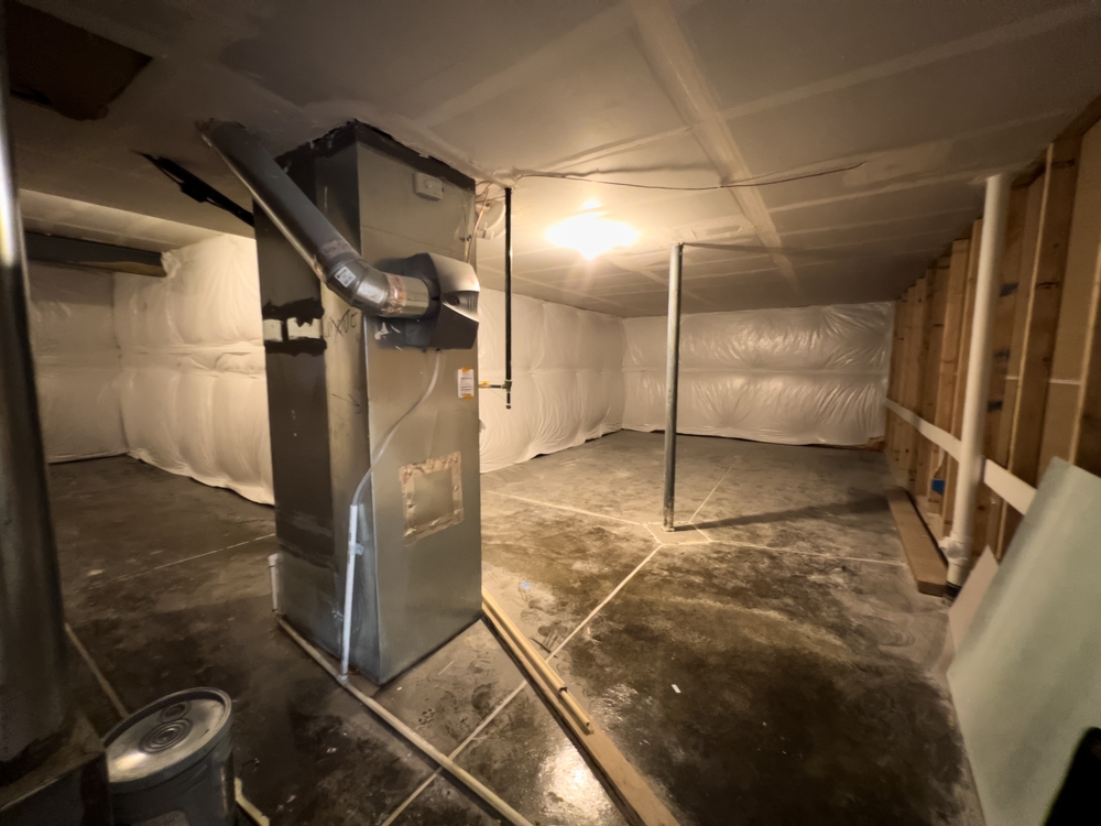 Homeowner discussing a new furnace purchase with an HVAC professional