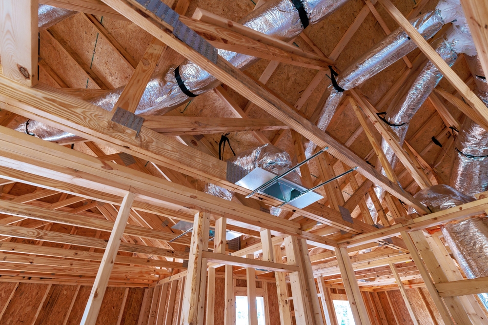 HVAC professional inspecting ductwork for an HVAC installation