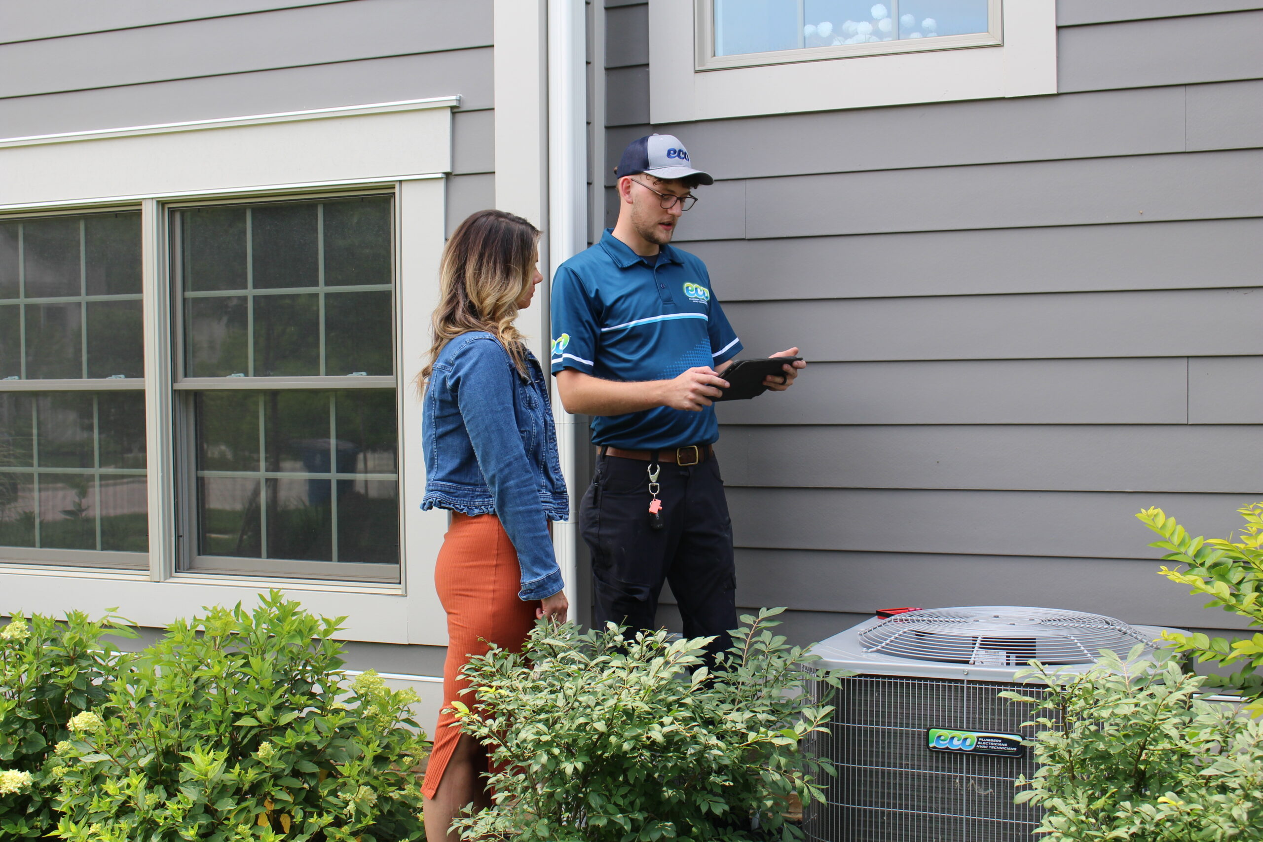 HVAC technician performing AC repair and servicing in Centerville OH at a residential home