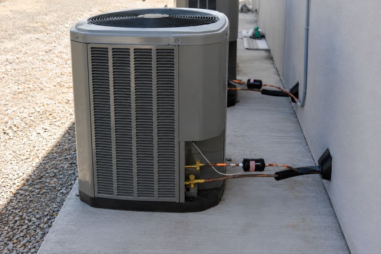 HVAC technician performing an AC replacement in Dayton Ohio at a residential home