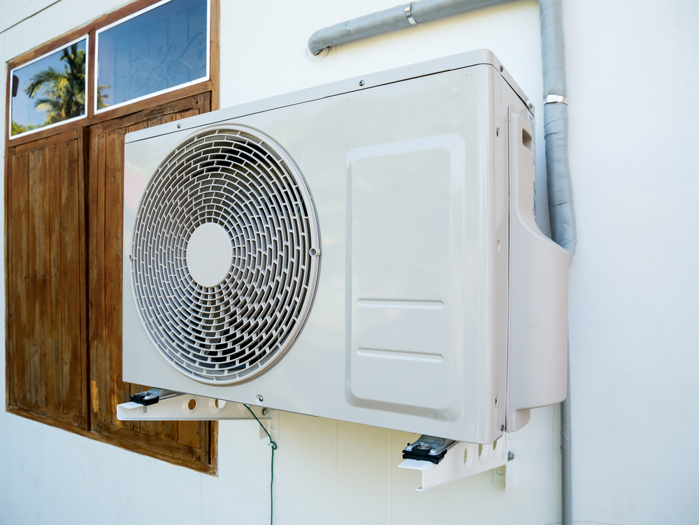 HVAC technician performing ductless mini split installation in Dayton at a residential home