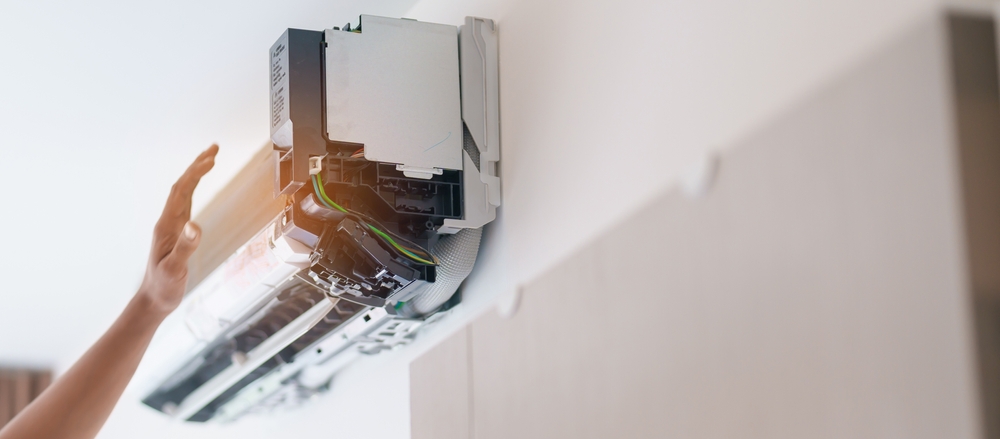 technician performing air conditioning maintenance done right for heat defense